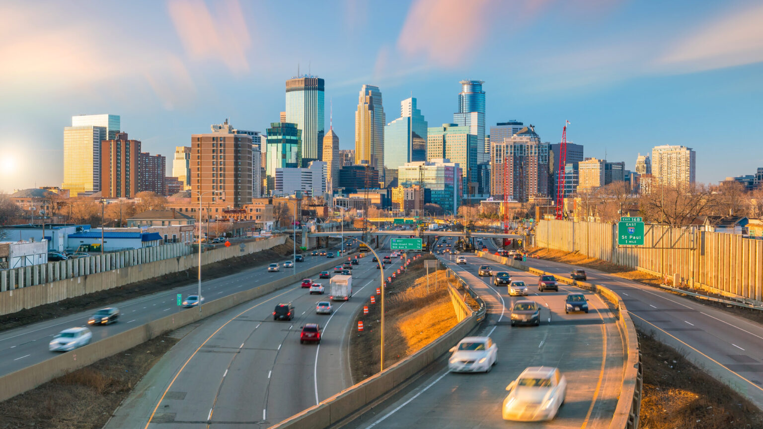 Busy city highway with cars and trucks heading toward a skyline, representing workout equipment transportation across Los Angeles